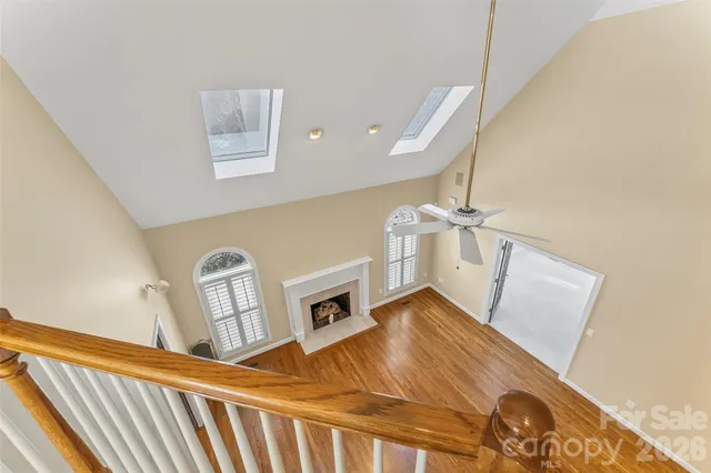 a bathroom with a glass door shower a sink and a mirror