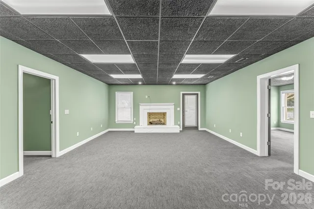 a view of a patio with table and chairs and potted plants