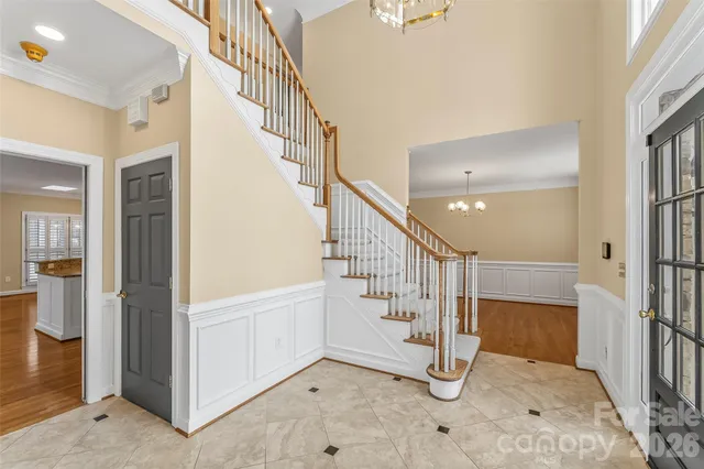 a view of a room with wooden floor and windows