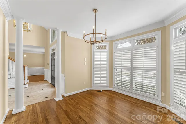 a large bathroom with a granite countertop sink a mirror and shower