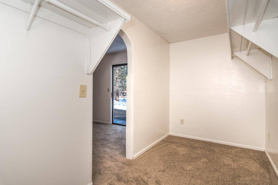 19166 Kiowa Road Bend, OR 97702 - Photo 20 of 34 a view of an empty room with windows