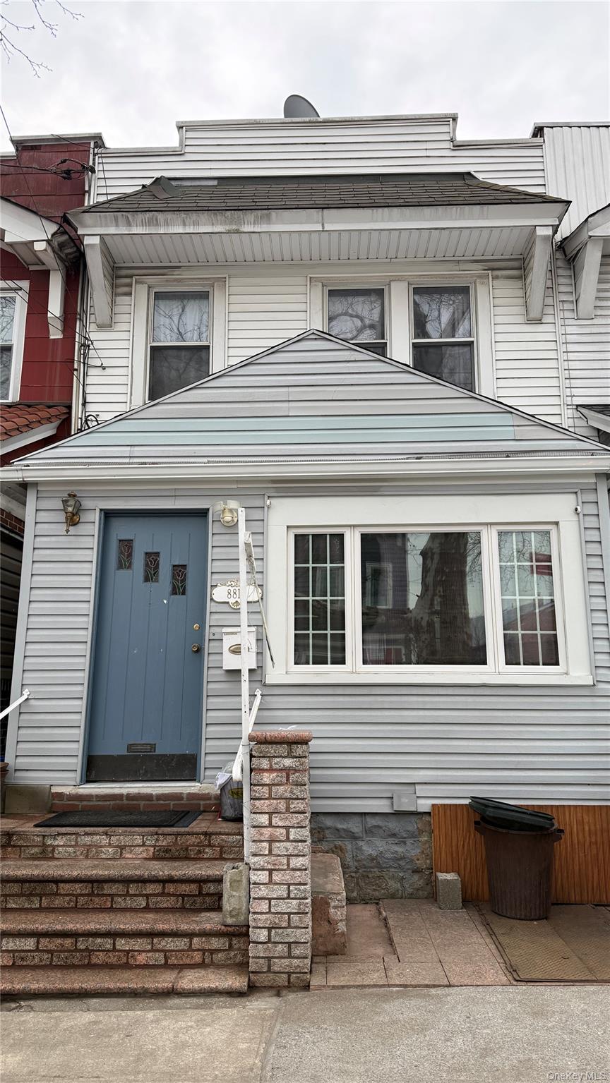 88-10 78th Street Queens, NY 11421 - Photo 1 of 19 a front view of a house with a window