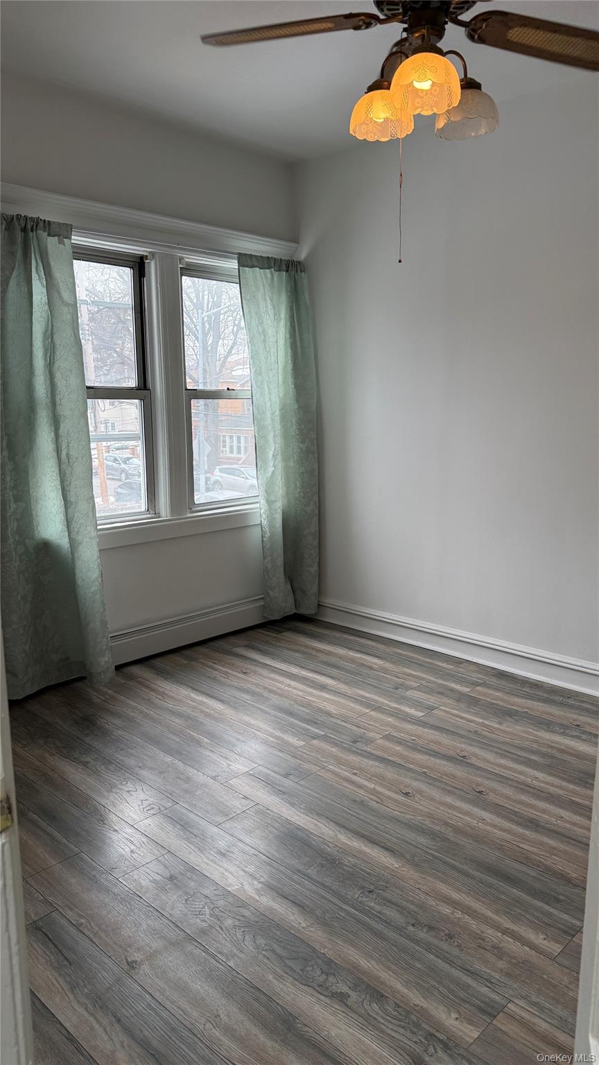 88-10 78th Street Queens, NY 11421 - Photo 14 of 19 an empty room with a window
