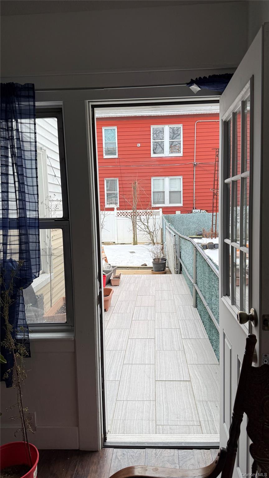 88-10 78th Street Queens, NY 11421 - Photo 18 of 19 a room with window and furniture