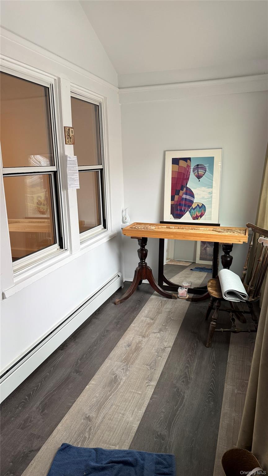 88-10 78th Street Queens, NY 11421 - Photo 2 of 19 a living room with furniture and a window