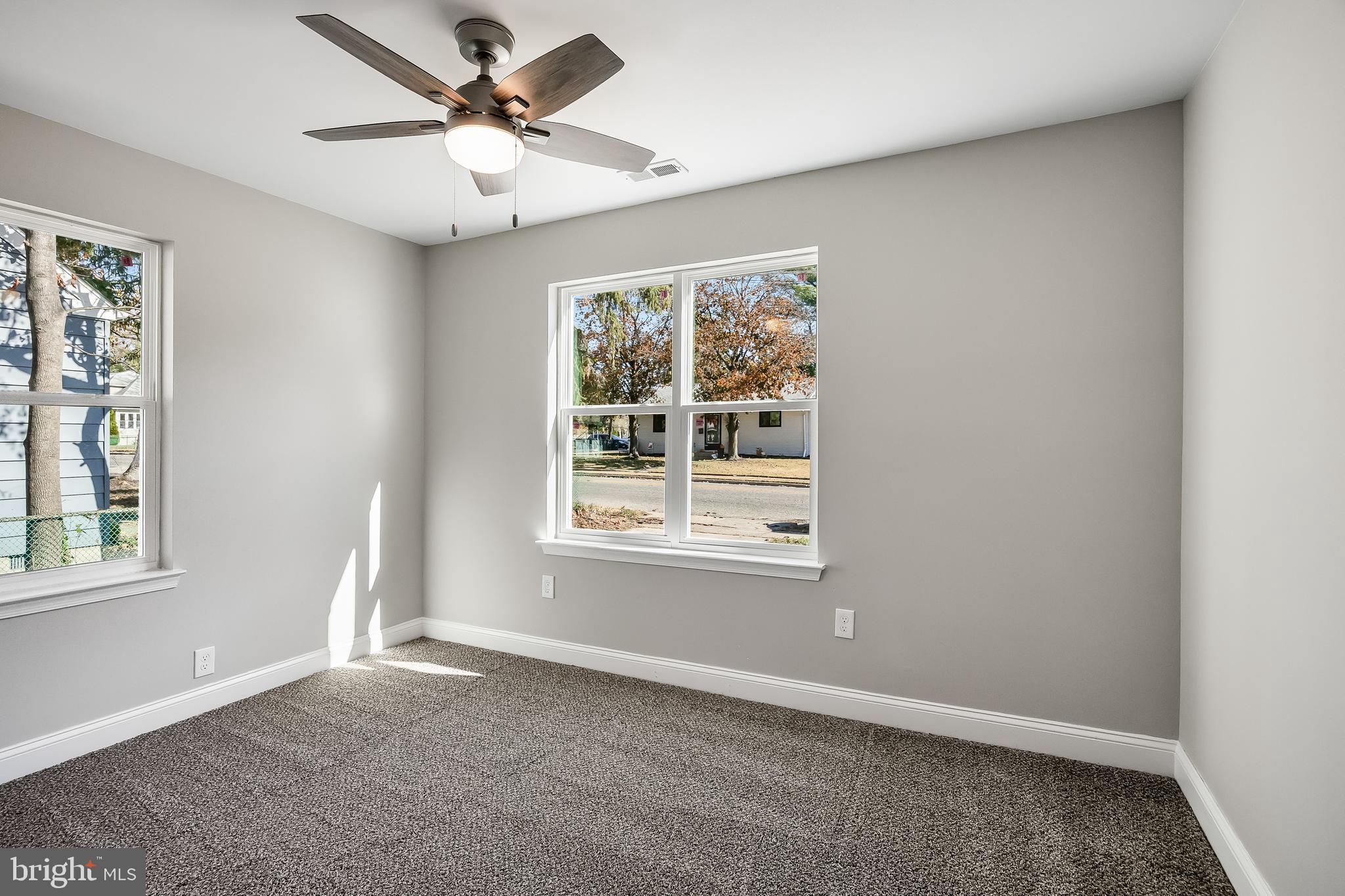 104 West Park Avenue Lindenwold, NJ 08021 - Photo 17 of 26 an empty room with chandelier fan and windows