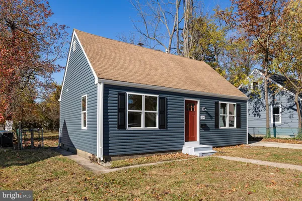 a view of a house with a tree