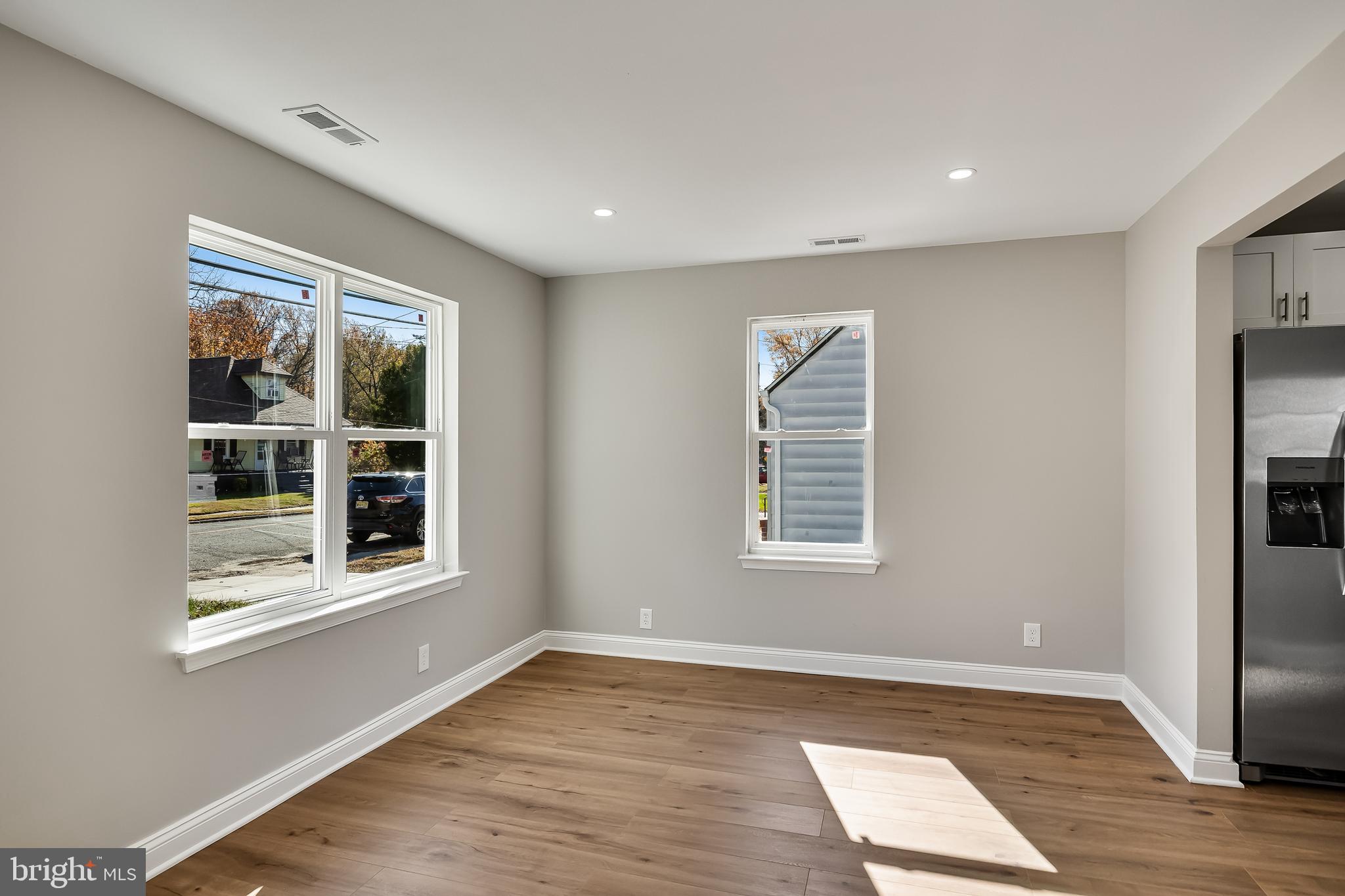 104 West Park Avenue Lindenwold, NJ 08021 - Photo 7 of 26 a view of an empty room with wooden floor and a window