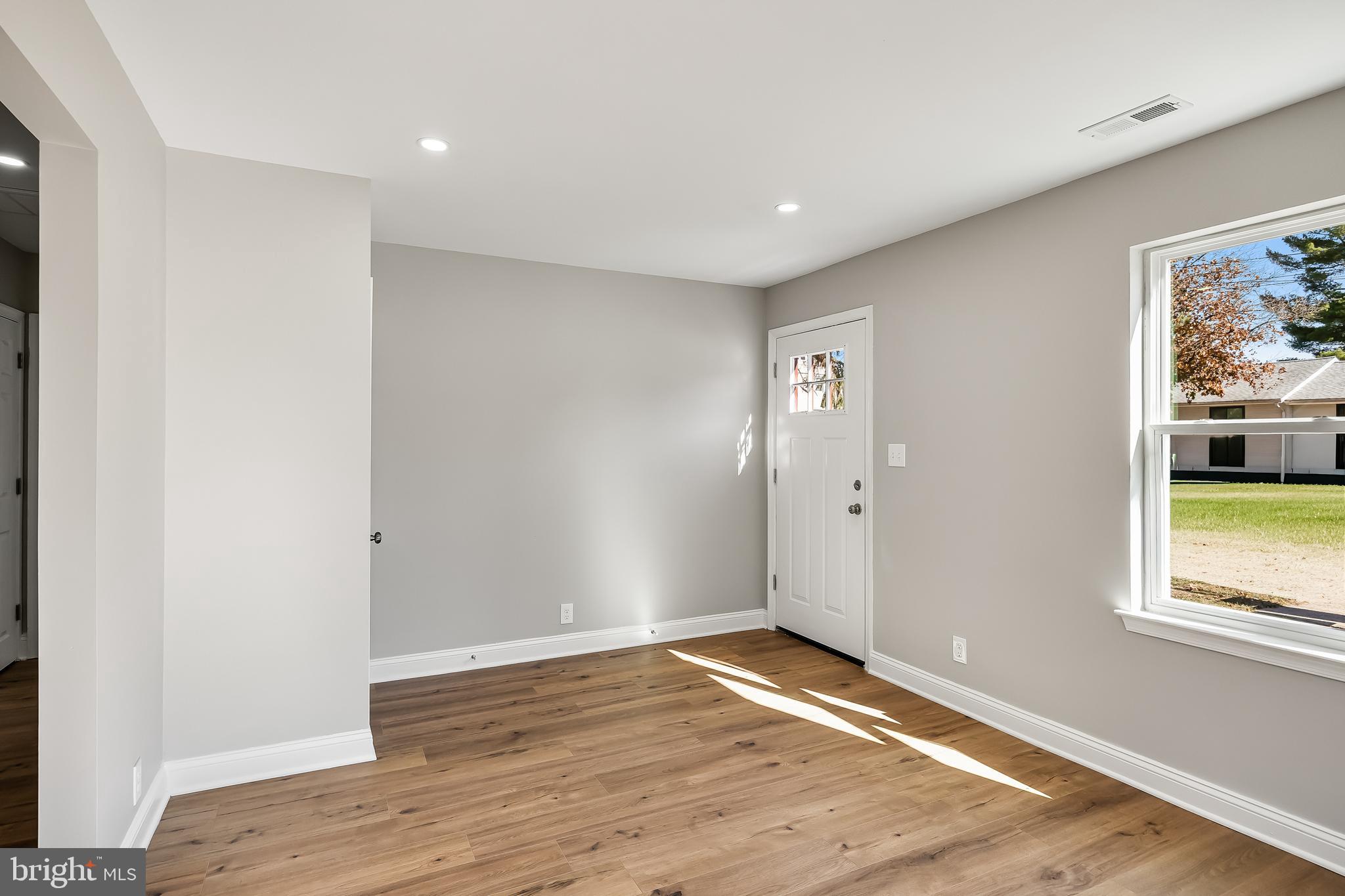 104 West Park Avenue Lindenwold, NJ 08021 - Photo 9 of 26 a view of empty room with wooden floor and fan