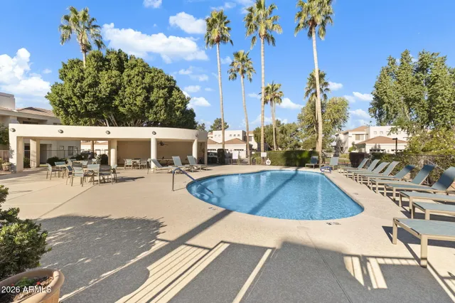 a view of a swimming pool with a patio