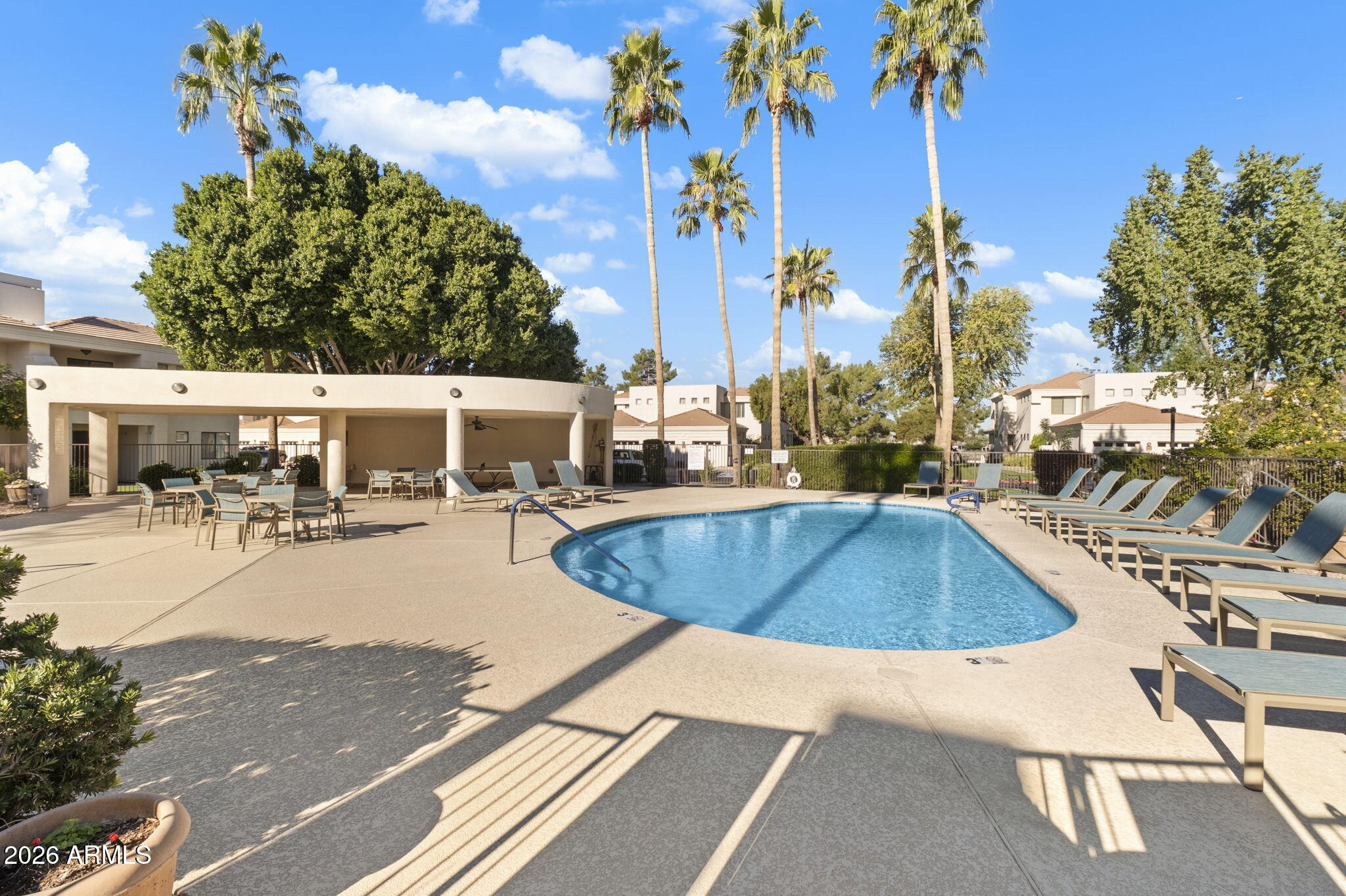 a view of a swimming pool with a patio