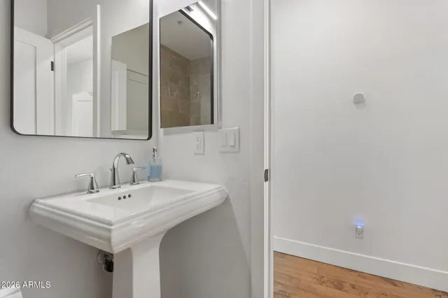a bathroom with a sink and a mirror