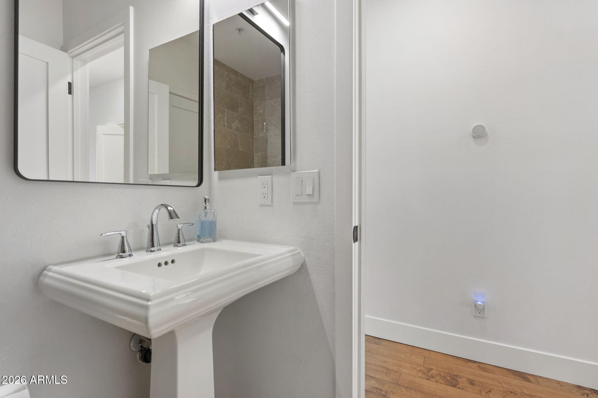8270 North Hayden Road, Unit 1036 Scottsdale, AZ 85258 - Photo 12 of 20 a bathroom with a sink and a mirror