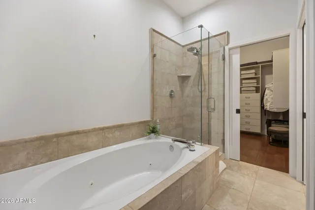 a bathroom with a bathtub and a shower