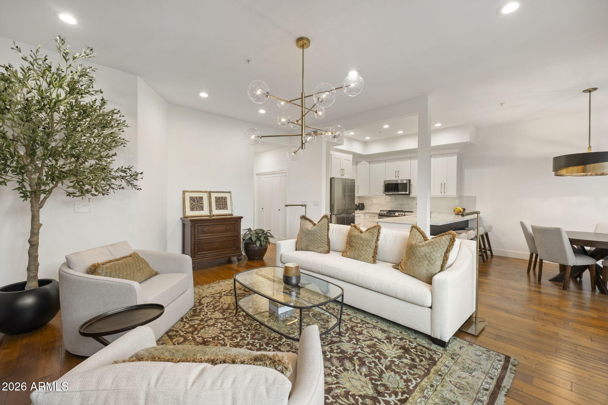 8270 North Hayden Road, Unit 1036 Scottsdale, AZ 85258 - Photo 3 of 20 a living room with furniture and a chandelier