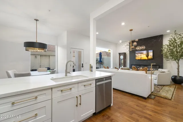a open kitchen with sink cabinets and wooden floor