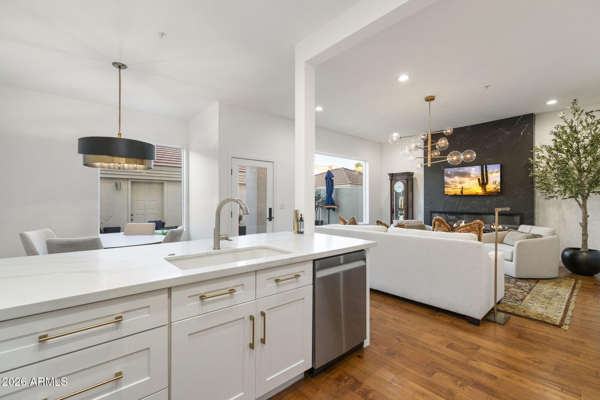 8270 North Hayden Road, Unit 1036 Scottsdale, AZ 85258 - Photo 9 of 20 a open kitchen with sink cabinets and wooden floor