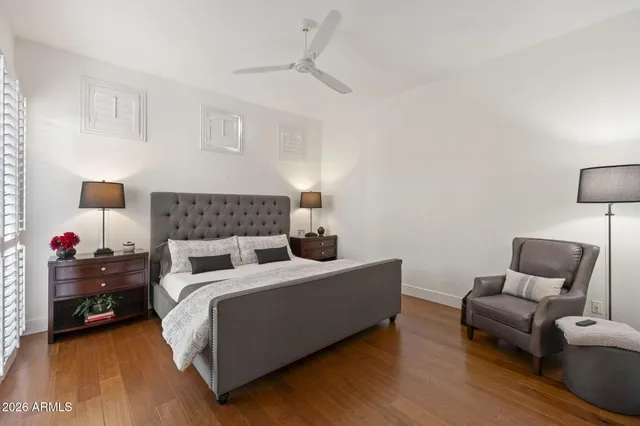 a bedroom with a bed and a couch