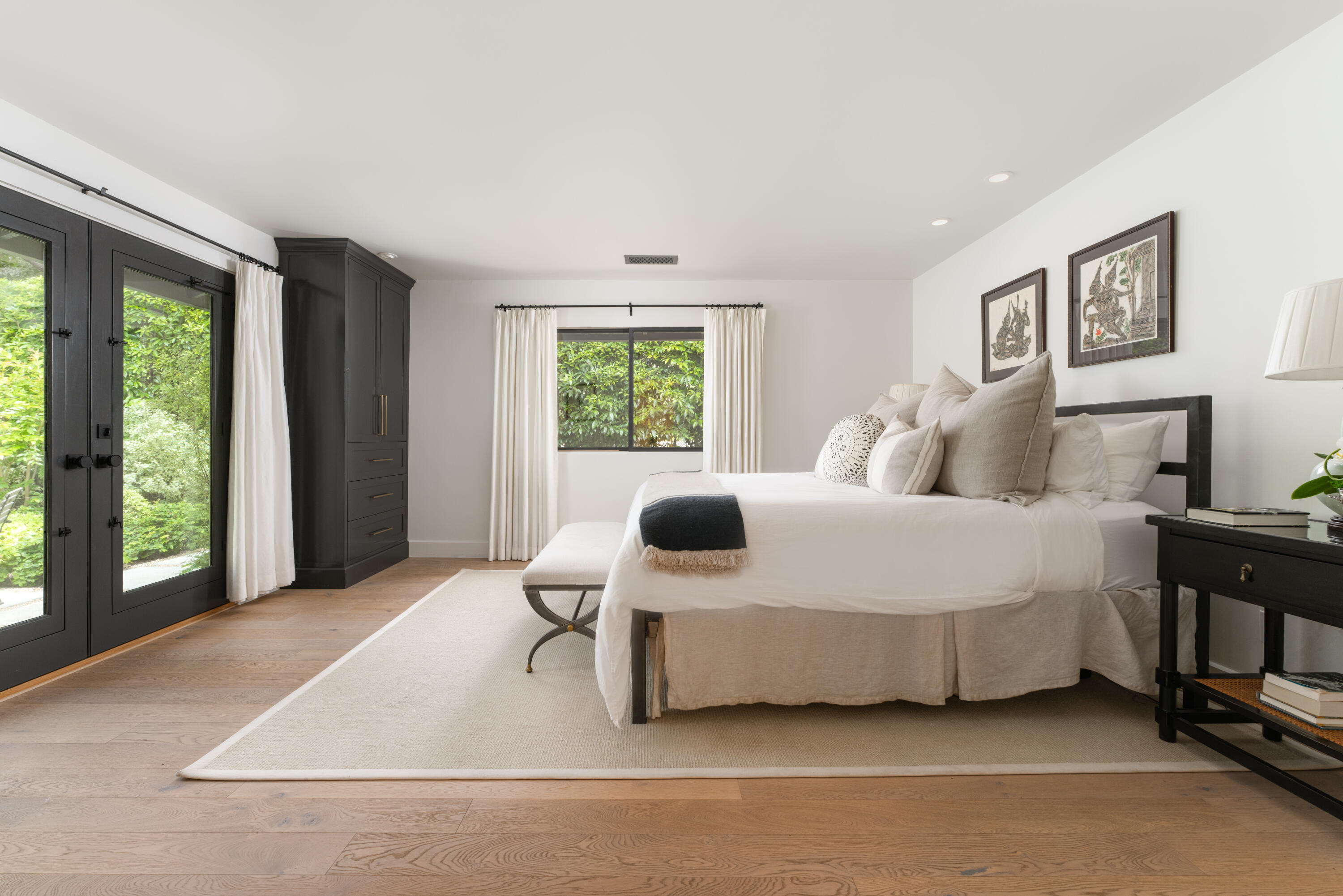 135 Pomar Lane Montecito, CA 93108 - Photo 17 of 29 a bedroom with a large bed and a large window