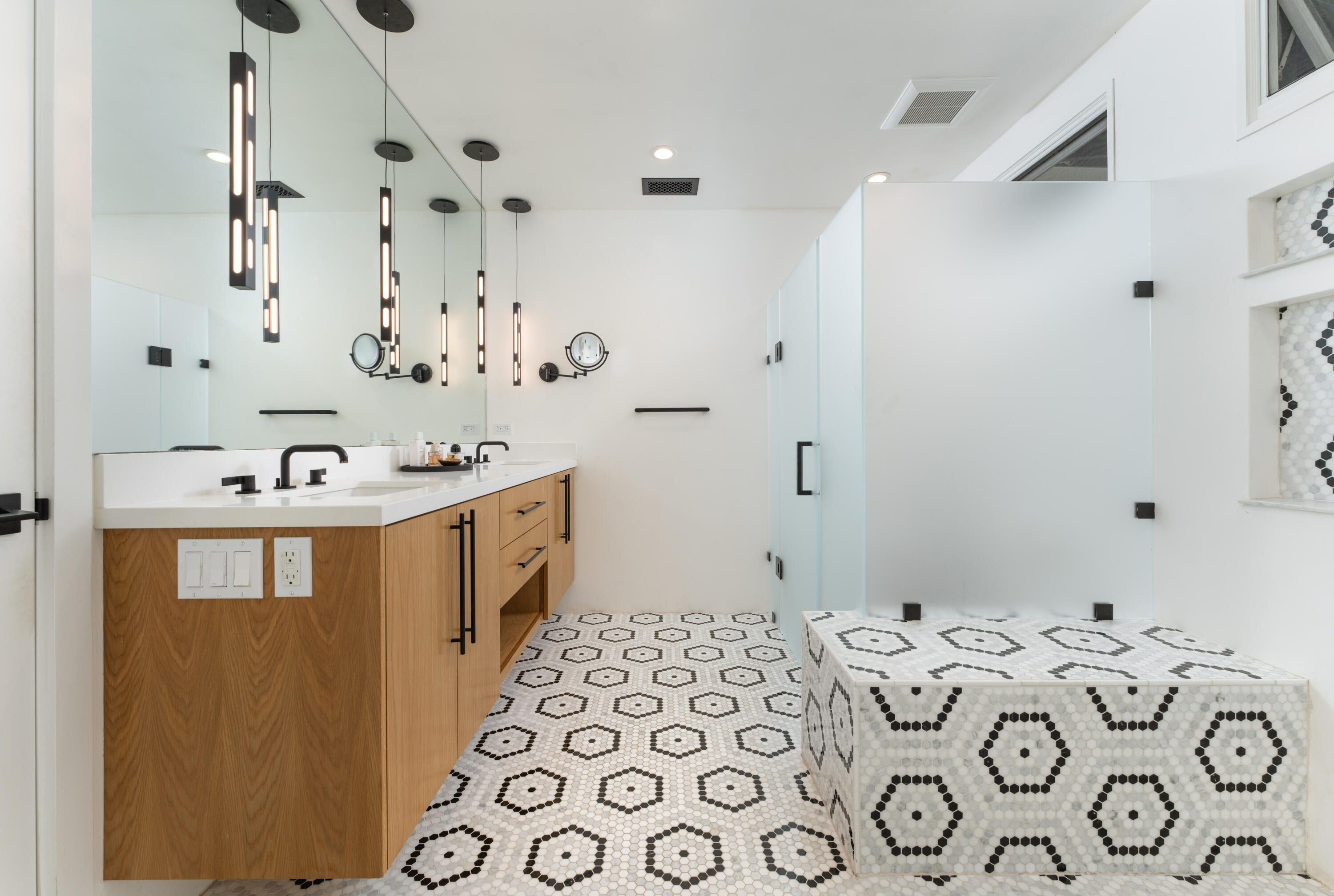 135 Pomar Lane Montecito, CA 93108 - Photo 18 of 29 a bathroom with a sink a mirror and a shower