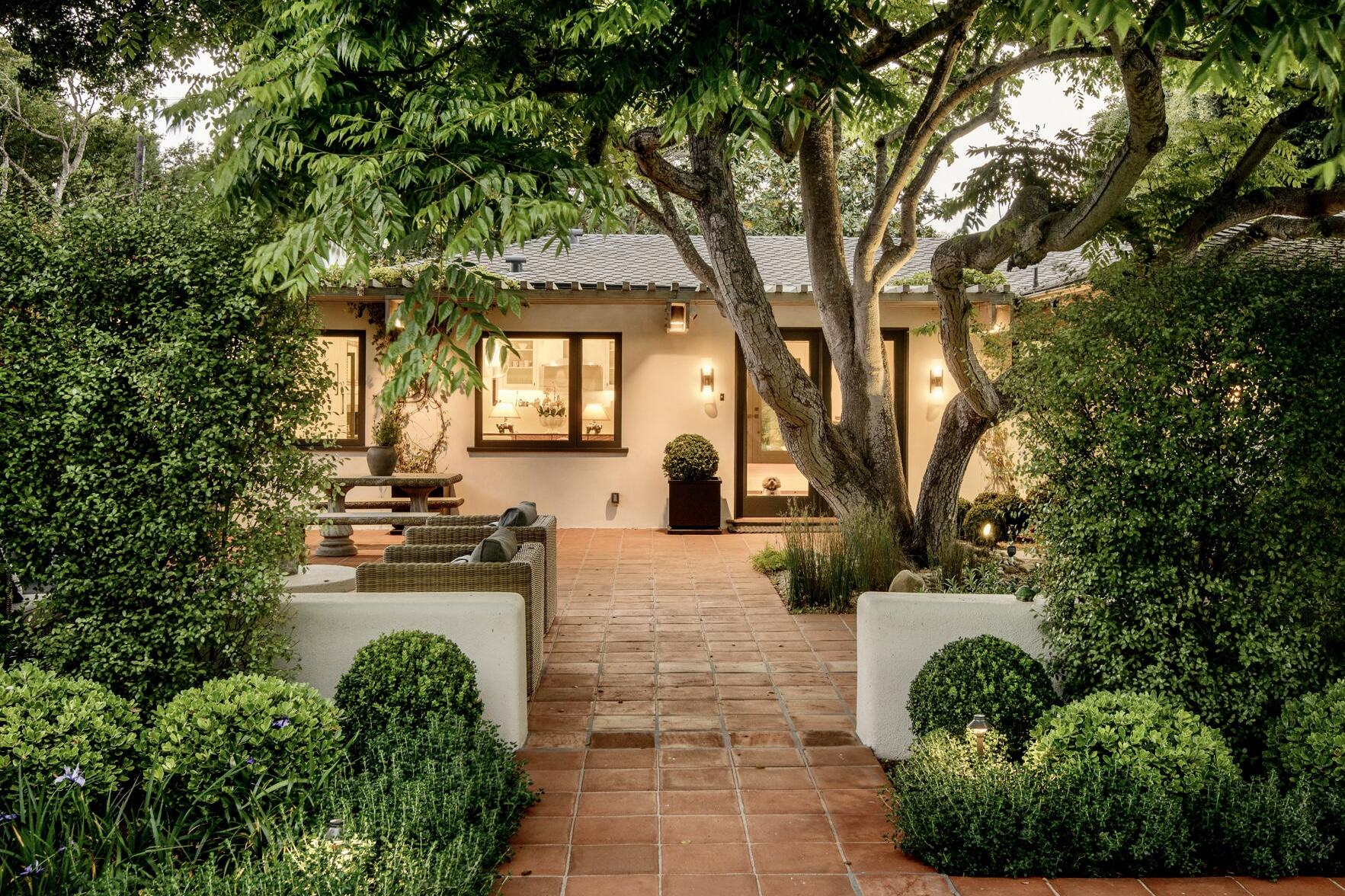 135 Pomar Lane Montecito, CA 93108 - Photo 3 of 29 a view of a yard with plants and large trees