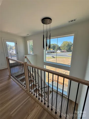 a view of a porch with wooden floor and stairs