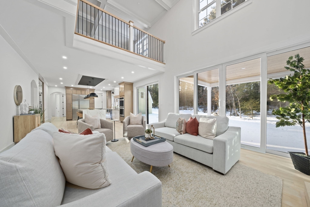 293 Cross Street Norwell, MA 02061 - Photo 11 of 42 a living room with furniture and a large window