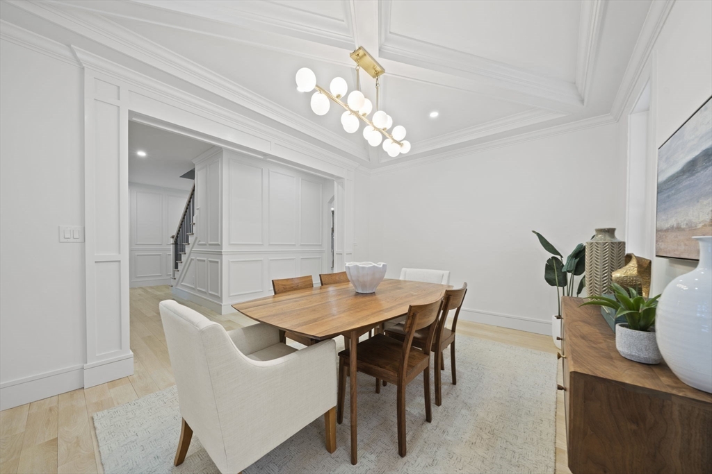 293 Cross Street Norwell, MA 02061 - Photo 13 of 42 a dining room with furniture potted plants and wooden floor