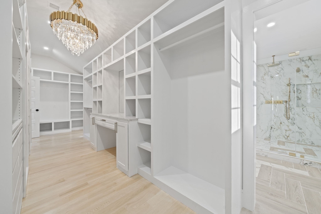 293 Cross Street Norwell, MA 02061 - Photo 28 of 42 a view of a walk in closet and bathroom