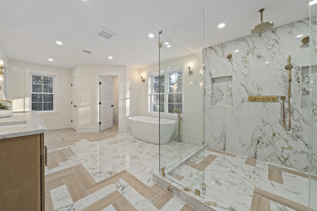 293 Cross Street Norwell, MA 02061 - Photo 30 of 42 a bathroom with a granite countertop sink mirror and shower