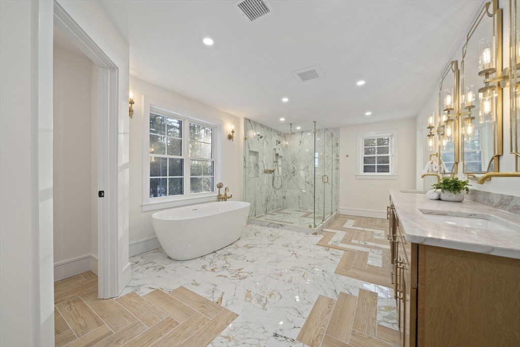 293 Cross Street Norwell, MA 02061 - Photo 31 of 42 a bathroom with a granite countertop sink and a mirror