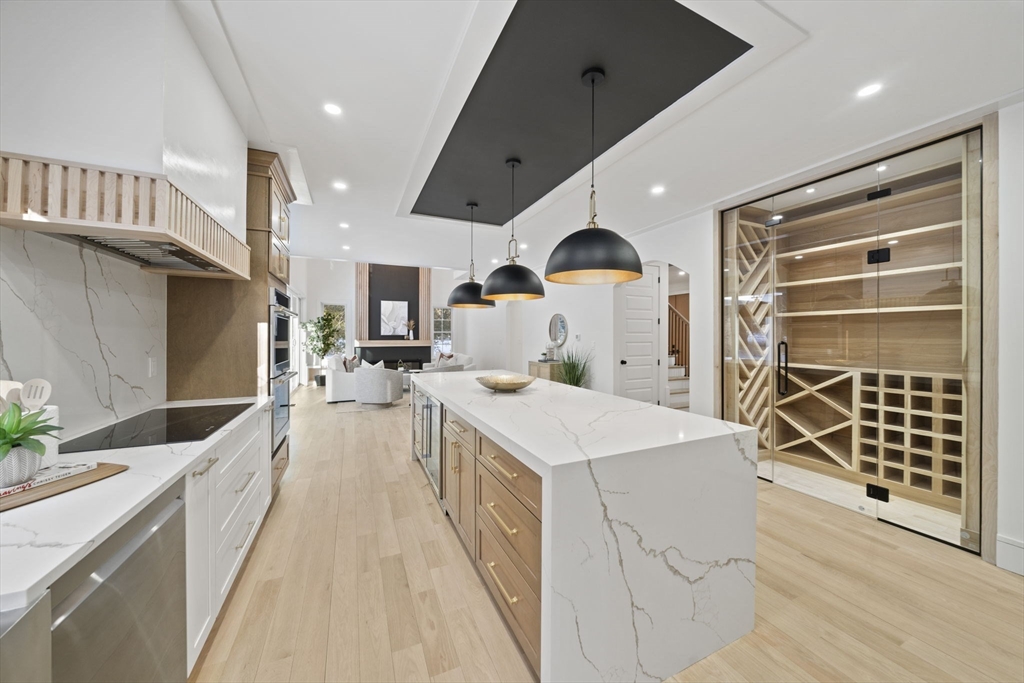 293 Cross Street Norwell, MA 02061 - Photo 7 of 42 a large white kitchen with sink and stainless steel appliances