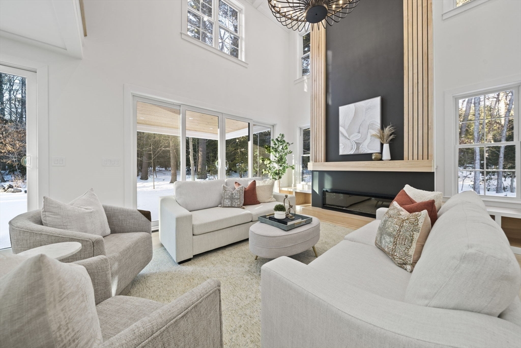 293 Cross Street Norwell, MA 02061 - Photo 8 of 42 a living room with furniture and a large window