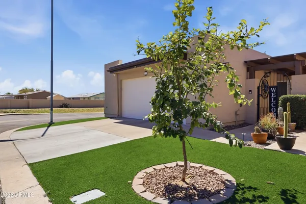a large kitchen with stainless steel appliances granite countertop a lot of counter space and wooden floor