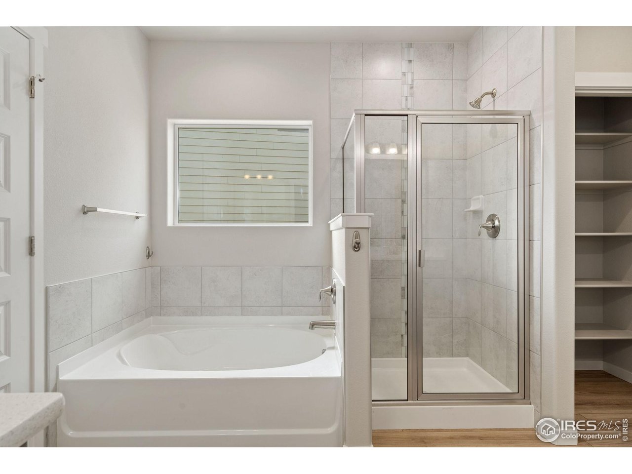 1247 Wild Basin Road Severance, CO 80550 - Photo 20 of 30 5 piece primary bedroom; shower has tiling up to ceiling