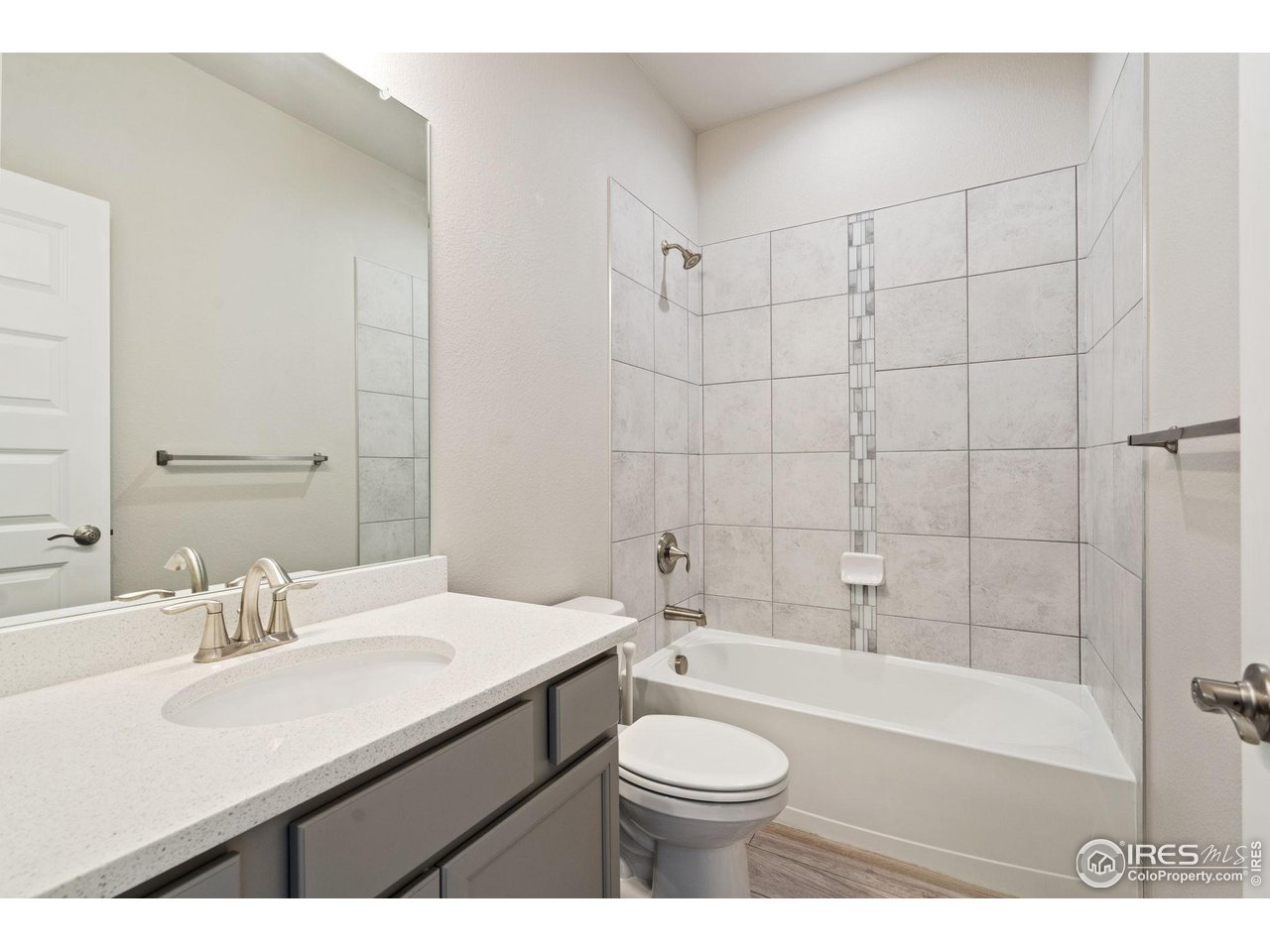 1247 Wild Basin Road Severance, CO 80550 - Photo 25 of 30 Hall bath with quartz counters and tiled shower
