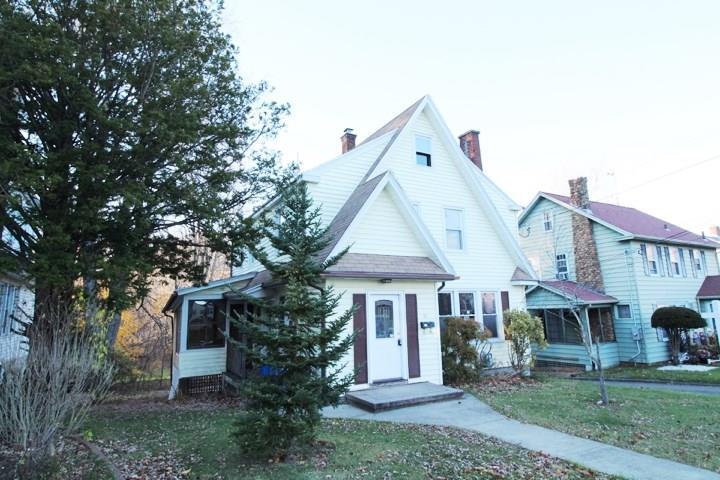85 Columbus Avenue Meriden, CT 06451 - Photo 1 of 1 a front view of a house with garden