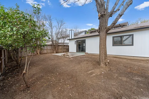 a view of a house with a tree