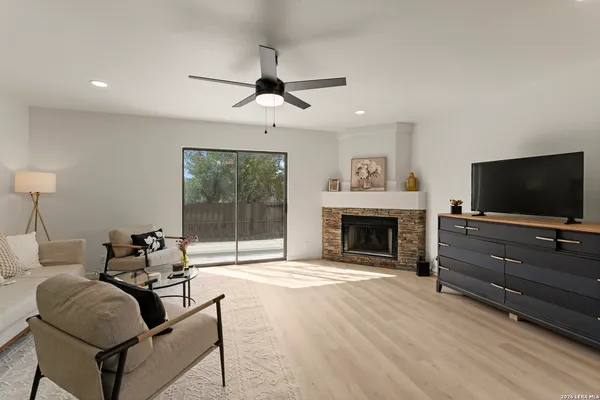 a living room with furniture and a fireplace