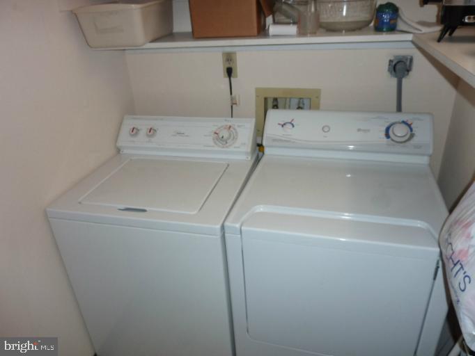 2903 Fallstaff Road, Unit 503 Baltimore, MD 21209 - Photo 18 of 20 a utility room with dryer and washer