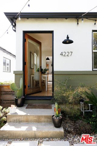 a front view of a house with sitting area