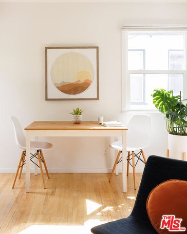 a room with a table chairs and a dining table
