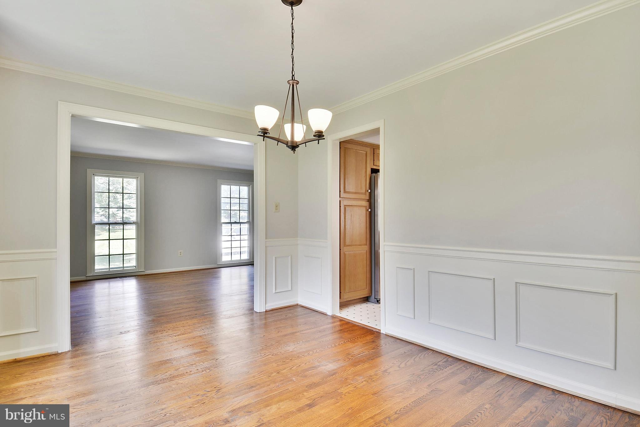 1026 Riva Ridge Drive Great Falls, VA 22066 - Photo 7 of 30 a view of empty room with wooden floor and window