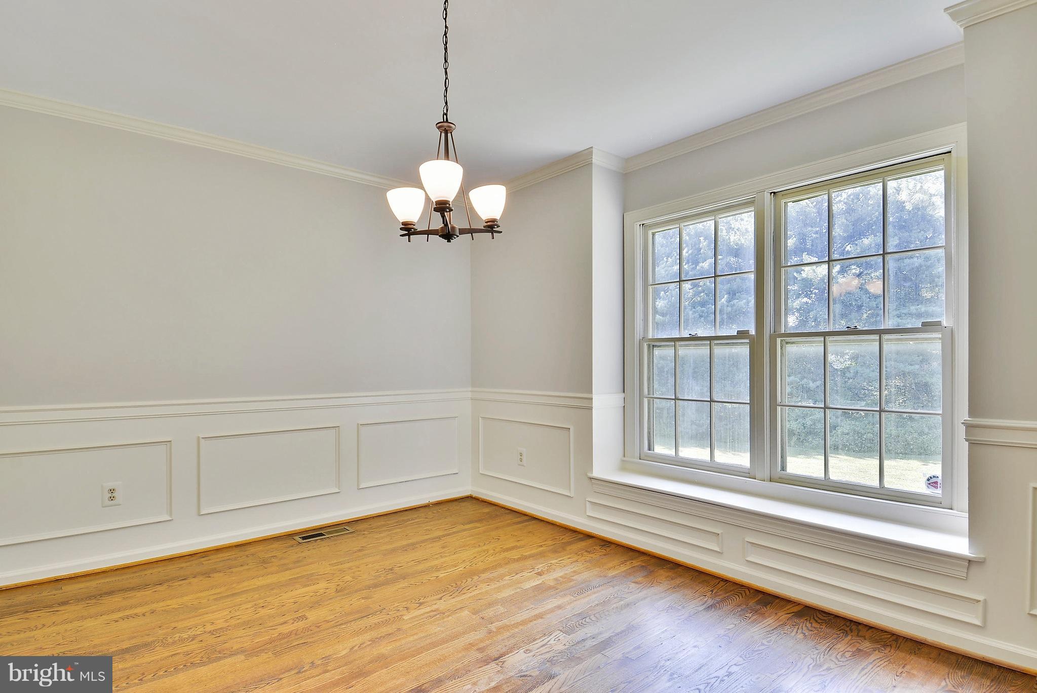 1026 Riva Ridge Drive Great Falls, VA 22066 - Photo 8 of 30 a view of a room with wooden floor and cabinet