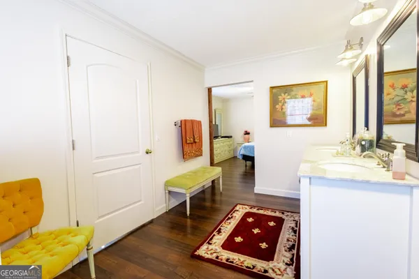 a view of a room with chairs and closet