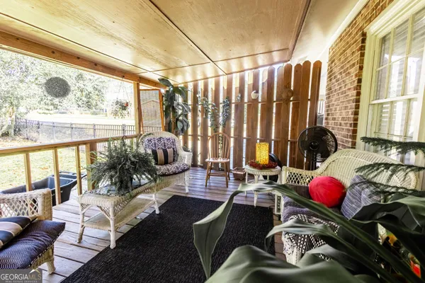 a front view of a house with outdoor seating