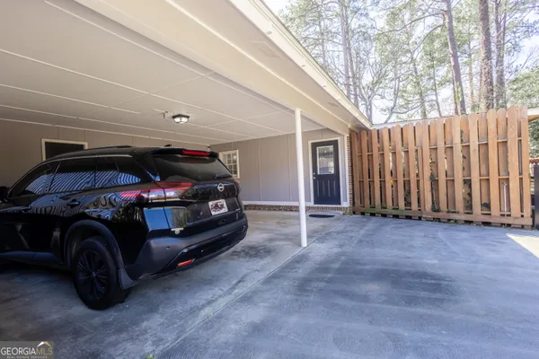 a large kitchen with stainless steel appliances kitchen island granite countertop a stove refrigerator and a wooden cabinets