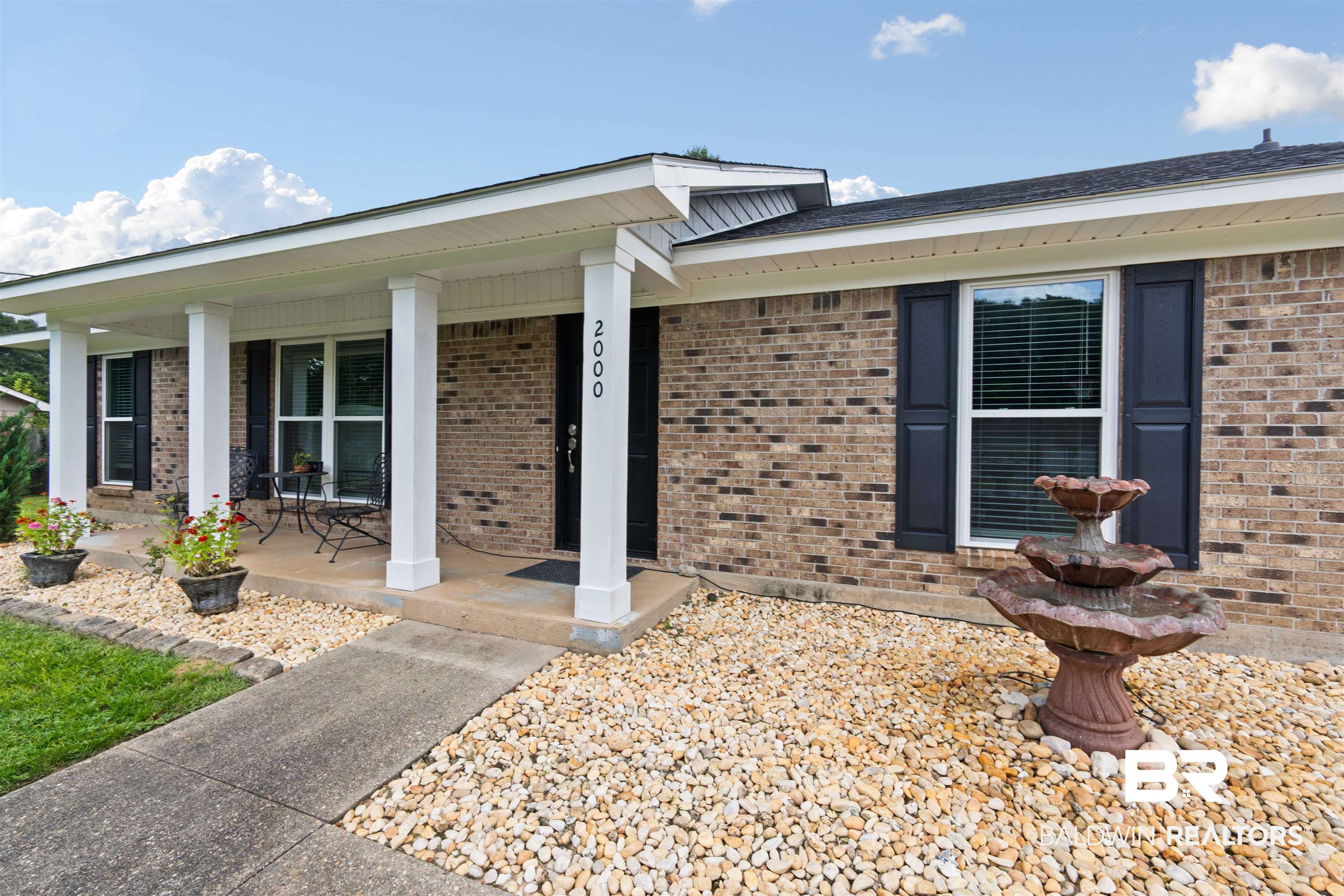 2000 Campfire Drive Semmes, AL 36575 - Photo 2 of 26 View of front of house featuring a porch