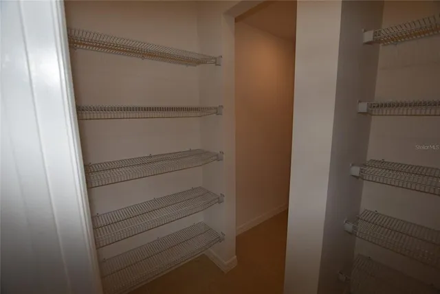 a view of small space with racks on the wall