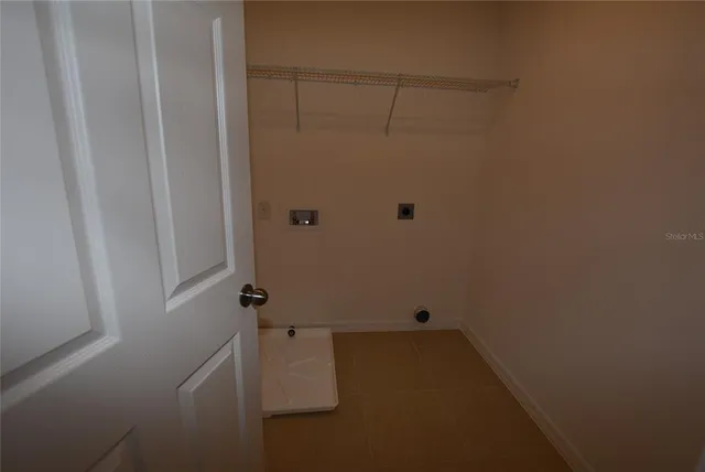 a view of wooden floor and windows in a room